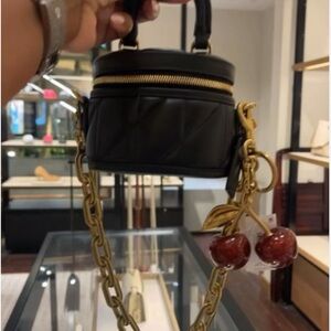 Brand New: Coach Black Mini Bag with Gold Chain and Cherry Charm